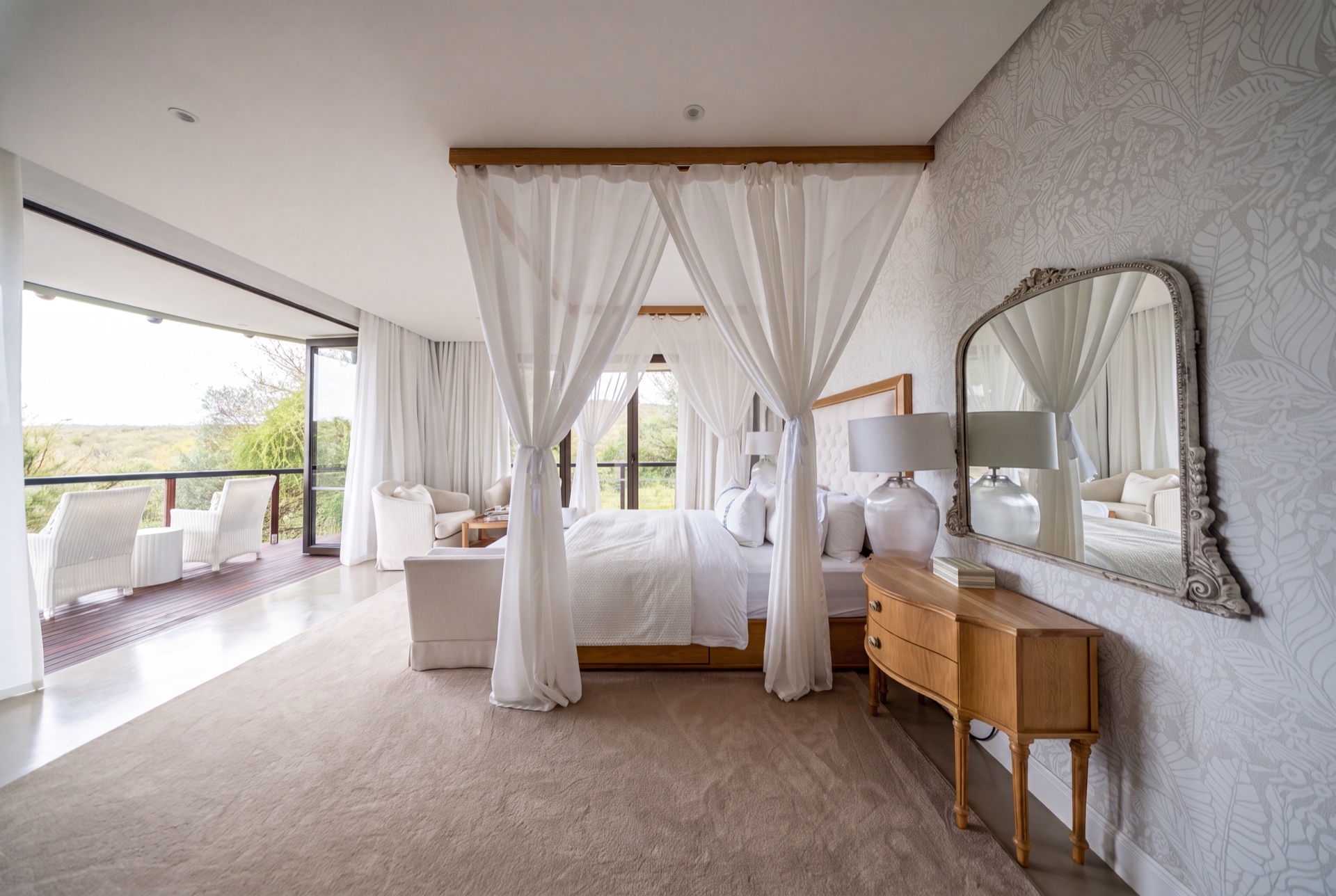 Four-poster bedroom suite opening to the deck