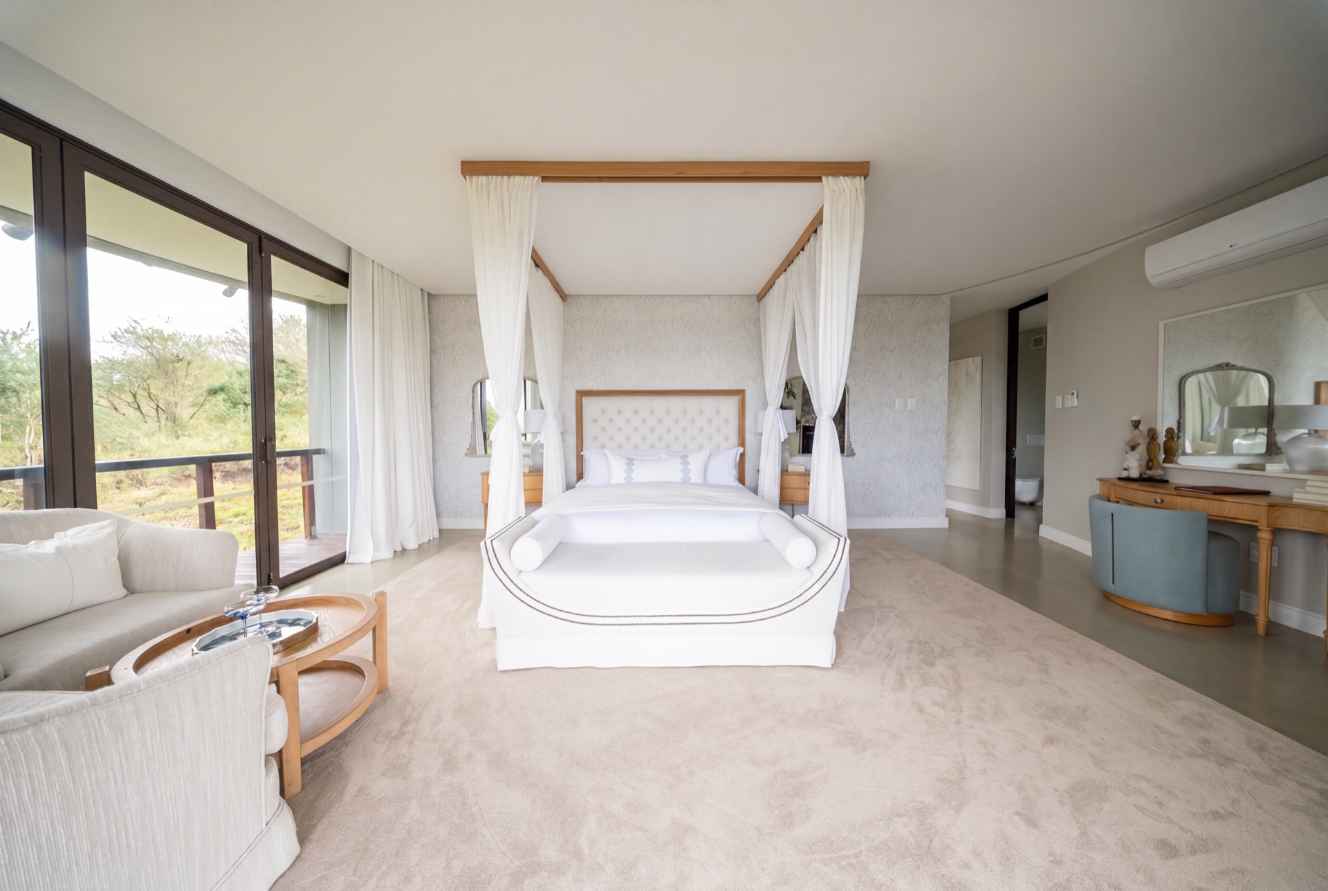 Principal bedroom suite with freestanding bath and reserve views