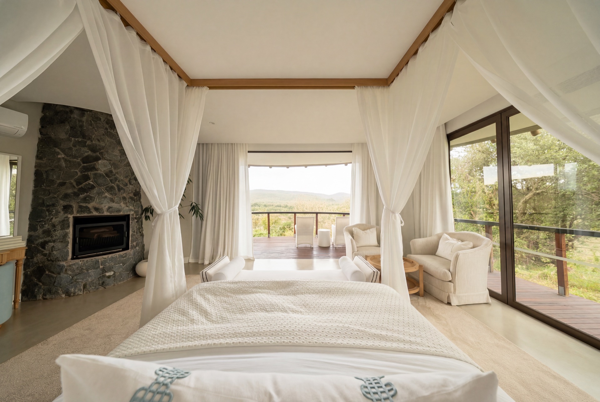 Bedroom suite with fireplace and stone detailing